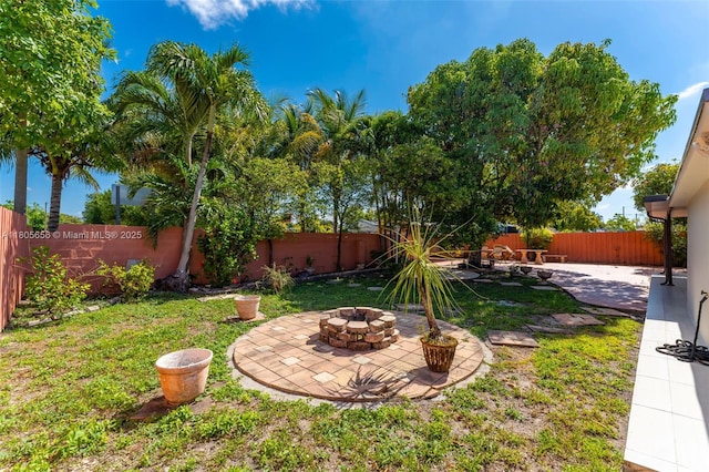 9875 SW 26th Ter, Miami, FL 33165 - view of yard with an outdoor fire pit and a patio area