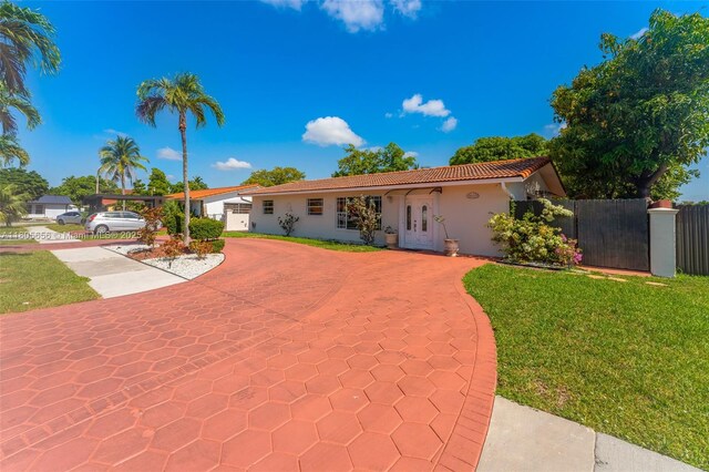 9875 SW 26th Ter, Miami, FL 33165 - view of front of house with a tiled roof and stucco siding