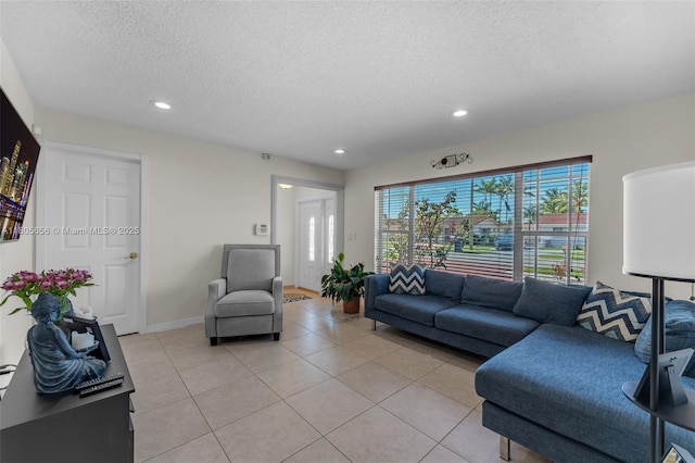 9875 SW 26th Ter, Miami, FL 33165 - living room with a textured ceiling, light tile patterned flooring, recessed lighting, and baseboards