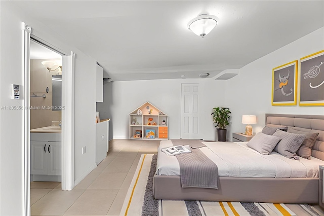 9875 SW 26th Ter, Miami, FL 33165 - bedroom with light tile patterned flooring and ensuite bath