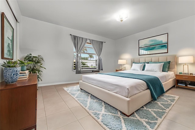 9875 SW 26th Ter, Miami, FL 33165 - bedroom featuring light tile patterned floors and baseboards