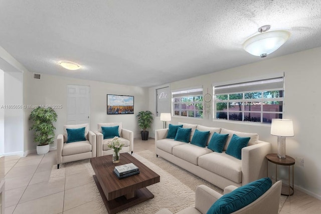 9875 SW 26th Ter, Miami, FL 33165 - living room featuring a textured ceiling and light tile patterned floors