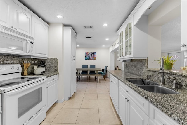 9875 SW 26th Ter, Miami, FL 33165 - kitchen with white appliances, a sink, glass insert cabinets, tasteful backsplash, and a textured ceiling