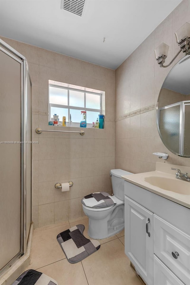 9875 SW 26th Ter, Miami, FL 33165 - full bath featuring tile walls, vanity, a shower stall, and tile patterned floors