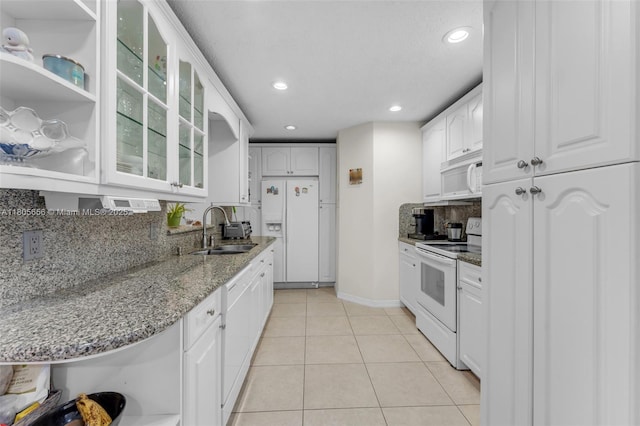 9875 SW 26th Ter, Miami, FL 33165 - kitchen featuring white appliances, a sink, glass insert cabinets, open shelves, and white cabinets