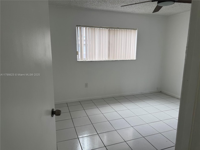 2710 W 76th St Unit 103, Hialeah, FL 33016 - unfurnished room with ceiling fan, a textured ceiling, light tile patterned floors, and baseboards