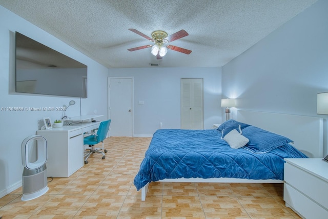 6755 NW 199th St, Hialeah, FL 33015 - bedroom featuring a textured ceiling, an office area, a ceiling fan, a closet, and baseboards