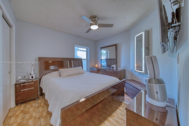 6755 NW 199th St, Hialeah, FL 33015 - bedroom featuring a textured ceiling, a ceiling fan, and a closet