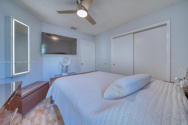 6755 NW 199th St, Hialeah, FL 33015 - bedroom featuring a closet, a textured ceiling, and ceiling fan