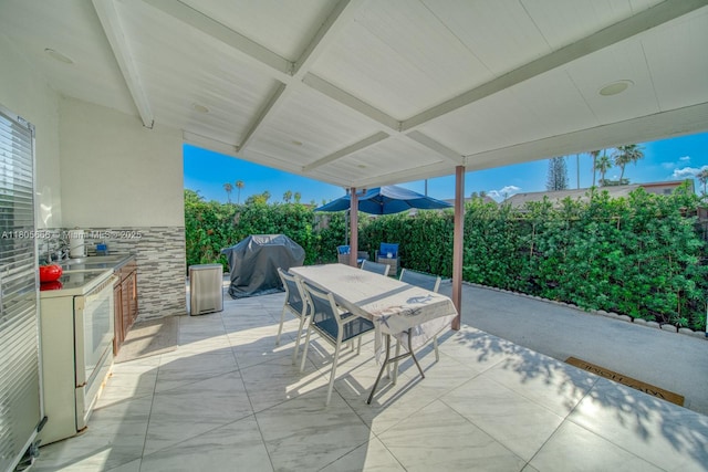 6755 NW 199th St, Hialeah, FL 33015 - view of patio / terrace featuring grilling area and outdoor dining area