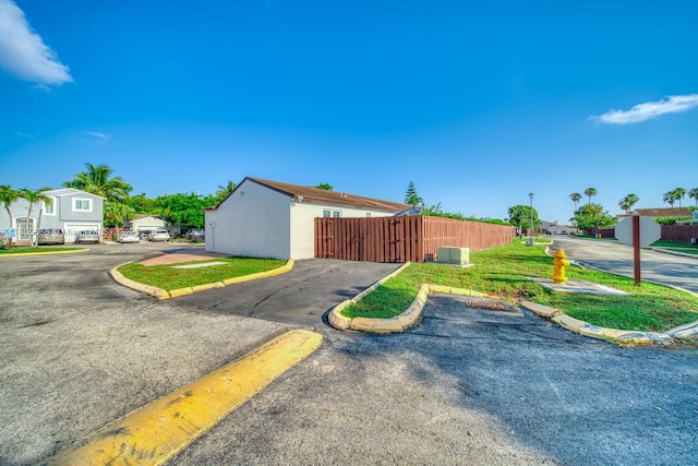 6755 NW 199th St, Hialeah, FL 33015 - view of front of house with uncovered parking and stucco siding