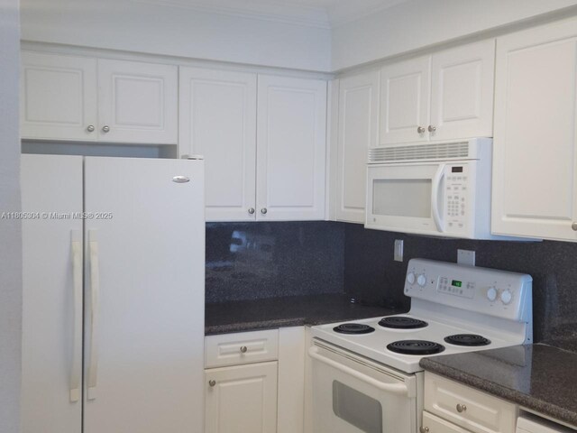 2501 S Ocean Dr Unit 1634, Hollywood, FL 33019 - kitchen featuring white appliances, backsplash, white cabinetry, and crown molding