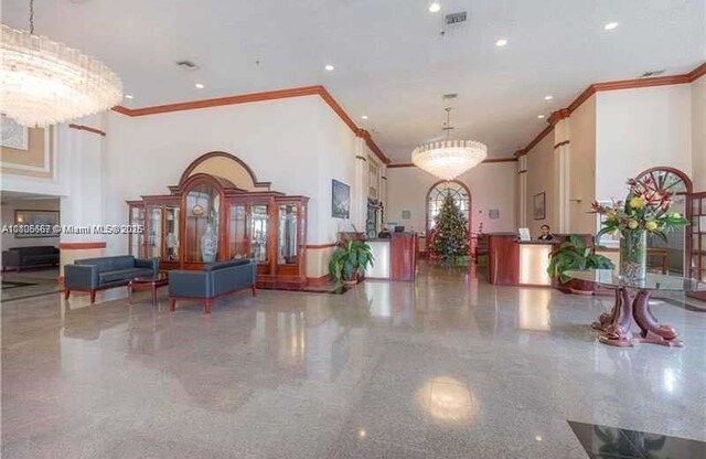 7601 E Treasure Dr Unit 1622, North Bay Village, FL 33141 - community lobby featuring crown molding, a high ceiling, and recessed lighting
