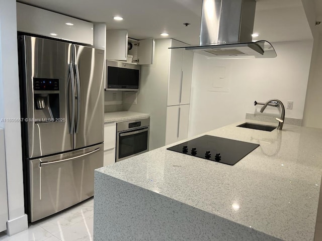 7601 E Treasure Dr Unit 1622, North Bay Village, FL 33141 - kitchen featuring stainless steel appliances, island exhaust hood, a sink, white cabinetry, and light stone countertops