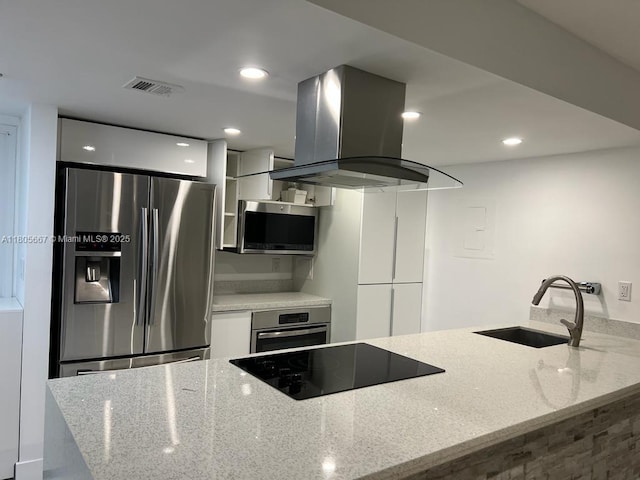 7601 E Treasure Dr Unit 1622, North Bay Village, FL 33141 - kitchen featuring stainless steel appliances, island exhaust hood, a sink, modern cabinets, and recessed lighting