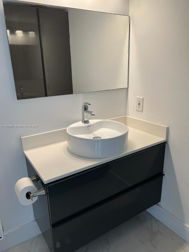 7601 E Treasure Dr Unit 1622, North Bay Village, FL 33141 - bathroom featuring marble finish floors, vanity, and baseboards