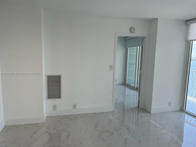 7601 E Treasure Dr Unit 1622, North Bay Village, FL 33141 - spare room with marble finish flooring, baseboards, and a smoke detector