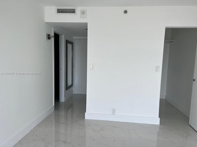 7601 E Treasure Dr Unit 1622, North Bay Village, FL 33141 - empty room featuring baseboards and light marble finish floors