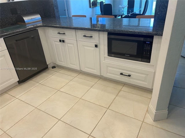 400 Diplomat Pkwy Unit 611, Hallandale Beach, FL 33009 - kitchen featuring black microwave, dishwashing machine, white cabinets, light tile patterned floors, and dark stone counters