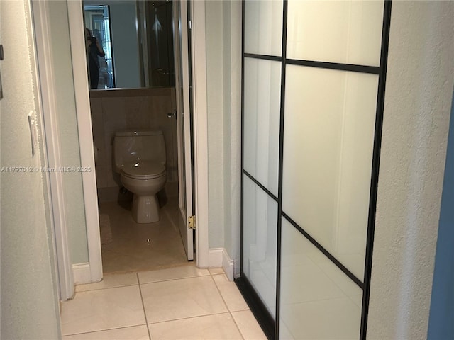 400 Diplomat Pkwy Unit 611, Hallandale Beach, FL 33009 - bathroom featuring toilet and tile patterned flooring