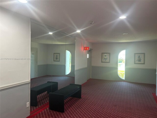 400 Diplomat Pkwy Unit 611, Hallandale Beach, FL 33009 - hall with carpet, wainscoting, and recessed lighting
