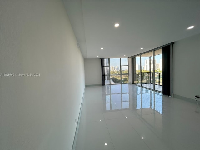 20335 W Country Club Dr Unit 903, Aventura, FL 33180 - unfurnished room with floor to ceiling windows, recessed lighting, and light tile patterned floors