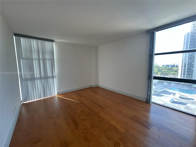 20335 W Country Club Dr Unit 903, Aventura, FL 33180 - spare room with wood finished floors and baseboards