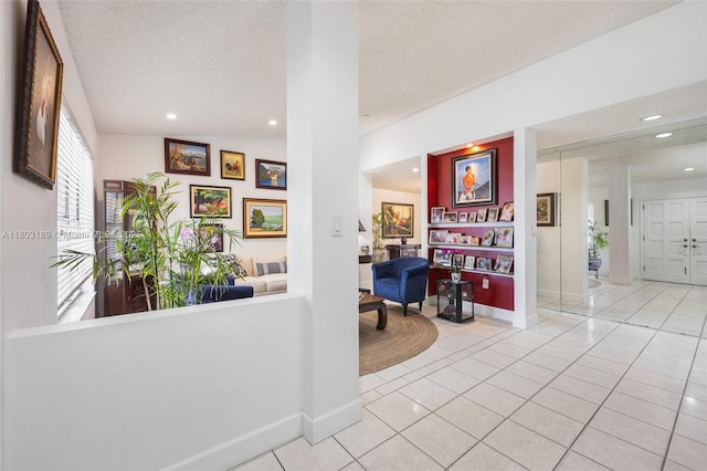 8610 SW 83rd St, Miami, FL 33143 - corridor featuring tile patterned flooring, recessed lighting, a textured ceiling, and baseboards