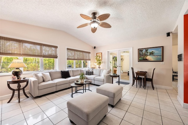 8610 SW 83rd St, Miami, FL 33143 - living room with vaulted ceiling, ceiling fan, light tile patterned floors, baseboards, and a textured ceiling