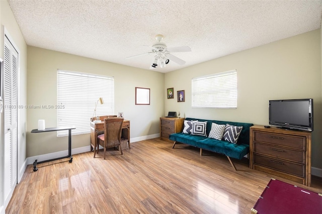 8610 SW 83rd St, Miami, FL 33143 - office space with light wood-type flooring, a ceiling fan, baseboards, and a textured ceiling