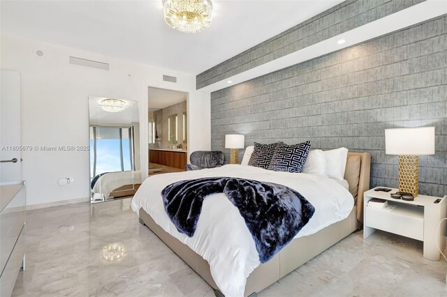88 SW 7th St Unit 3212, Miami, FL 33130 - bedroom featuring marble tiled floors, a chandelier, and ensuite bathroom