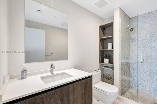 88 SW 7th St Unit 3212, Miami, FL 33130 - bathroom featuring a stall shower, toilet, and vanity
