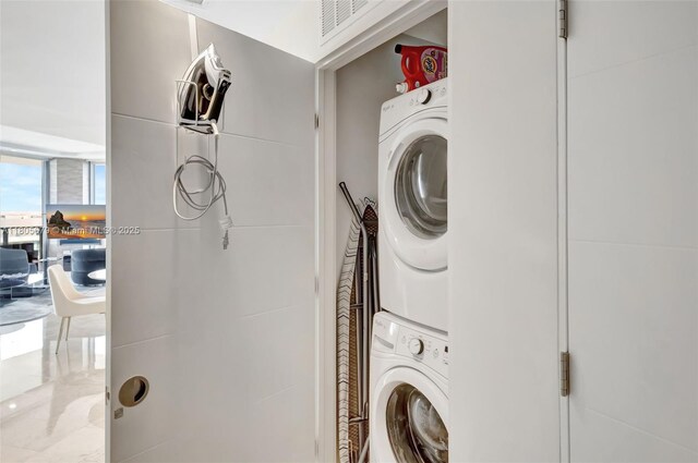 88 SW 7th St Unit 3212, Miami, FL 33130 - washroom with stacked washer / dryer