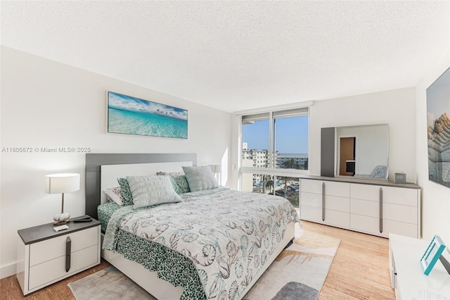 1500 S Ocean Dr Unit 7J, Hollywood, FL 33019 - bedroom featuring wood finished floors and a textured ceiling