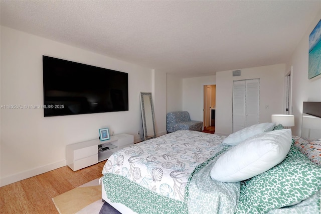 1500 S Ocean Dr Unit 7J, Hollywood, FL 33019 - bedroom featuring wood finished floors, a closet, and baseboards