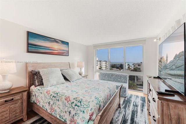 1500 S Ocean Dr Unit 7J, Hollywood, FL 33019 - bedroom with wood finished floors and a textured ceiling