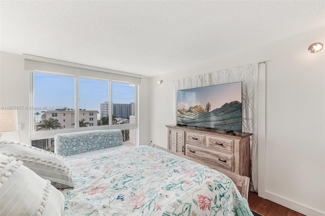 1500 S Ocean Dr Unit 7J, Hollywood, FL 33019 - bedroom featuring wood finished floors and a textured ceiling