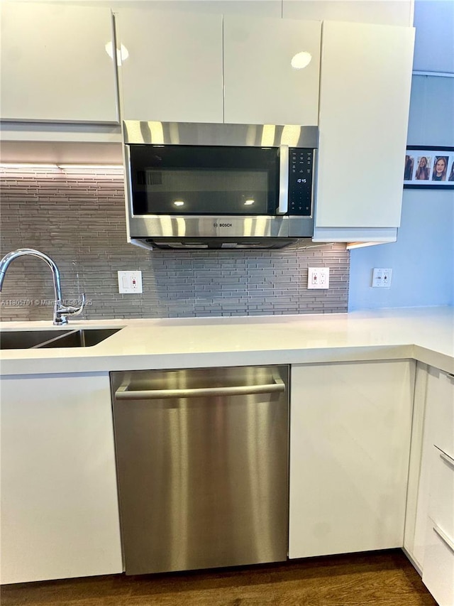 200 Leslie Dr Unit 817, Hallandale Beach, FL 33009 - kitchen with appliances with stainless steel finishes, a sink, light countertops, and white cabinets