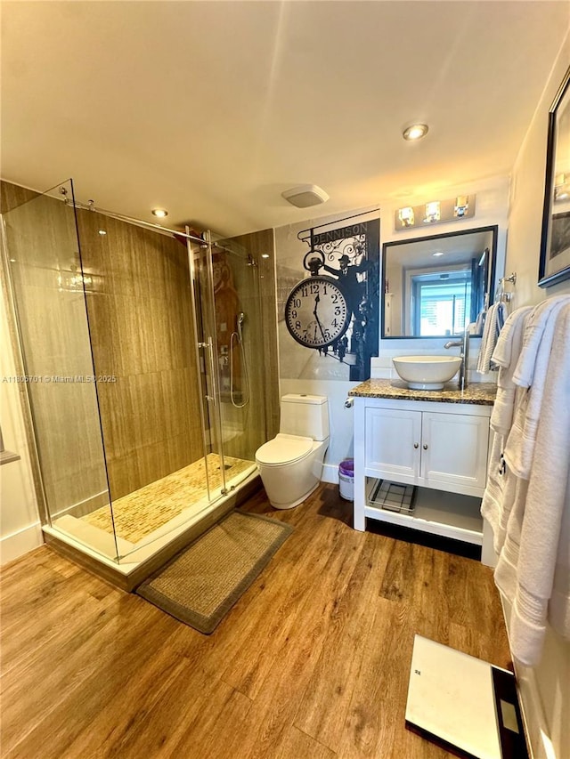 200 Leslie Dr Unit 817, Hallandale Beach, FL 33009 - full bath with a stall shower, wood finished floors, toilet, vanity, and recessed lighting