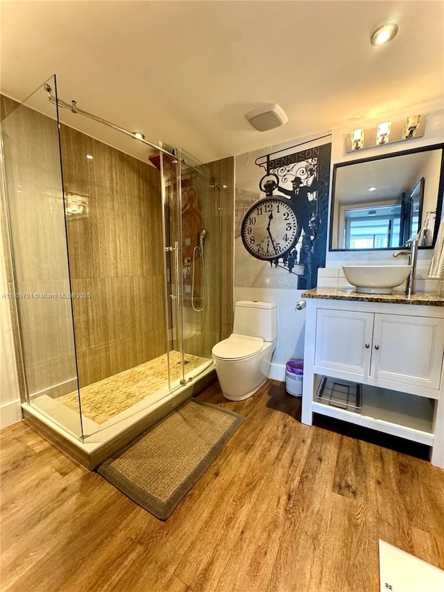 200 Leslie Dr Unit 817, Hallandale Beach, FL 33009 - bathroom featuring wood finished floors, a shower stall, vanity, and toilet