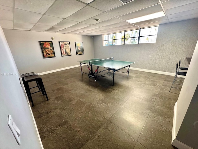 200 Leslie Dr Unit 817, Hallandale Beach, FL 33009 - recreation room featuring baseboards, a drop ceiling, and a textured wall