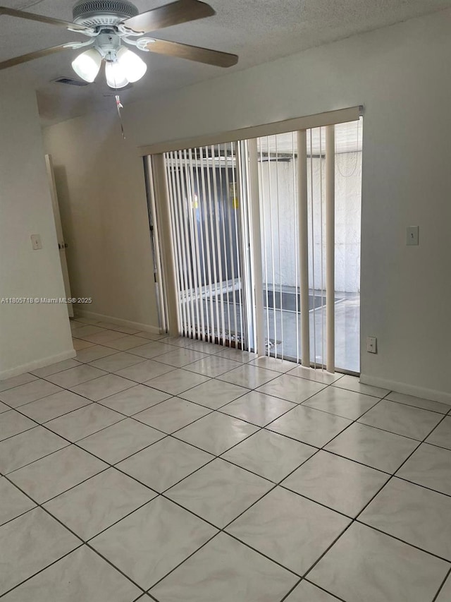 810 SW 73rd Ave Unit 9, North Lauderdale, FL 33068 - unfurnished room featuring ceiling fan, baseboards, and light tile patterned floors