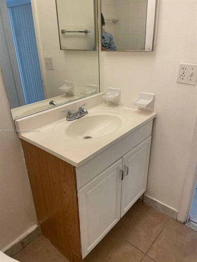 810 SW 73rd Ave Unit 9, North Lauderdale, FL 33068 - bathroom featuring tile patterned flooring, vanity, and baseboards