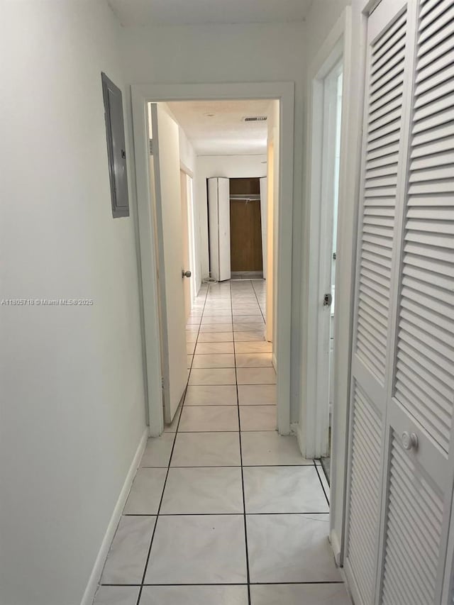810 SW 73rd Ave Unit 9, North Lauderdale, FL 33068 - corridor featuring electric panel, light tile patterned floors, and baseboards