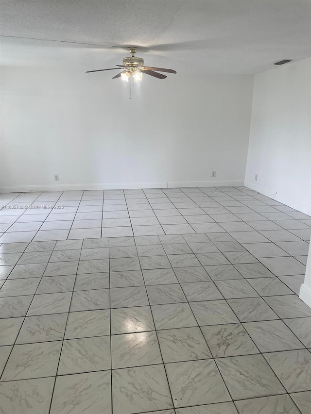 810 SW 73rd Ave Unit 9, North Lauderdale, FL 33068 - empty room featuring a ceiling fan, light tile patterned floors, and baseboards