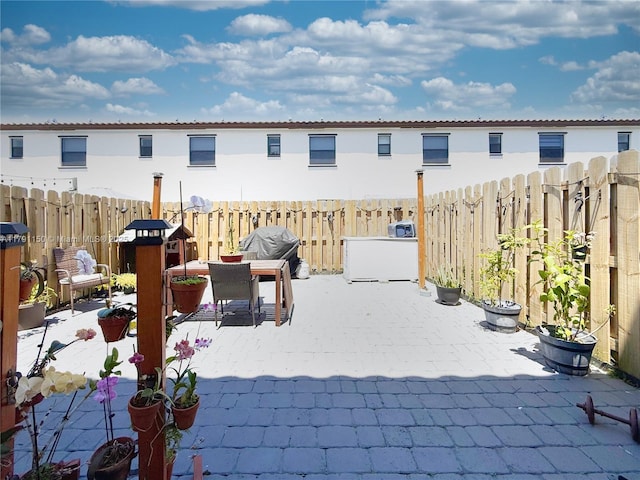 11871 SW 247th Ter, Homestead, FL 33032 - view of patio / terrace with a fenced backyard, outdoor dining space, and grilling area