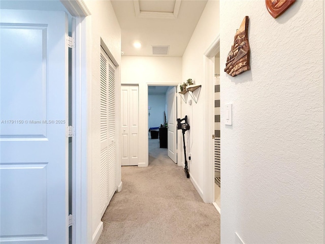 11871 SW 247th Ter, Homestead, FL 33032 - hallway featuring light carpet, a textured wall, and attic access