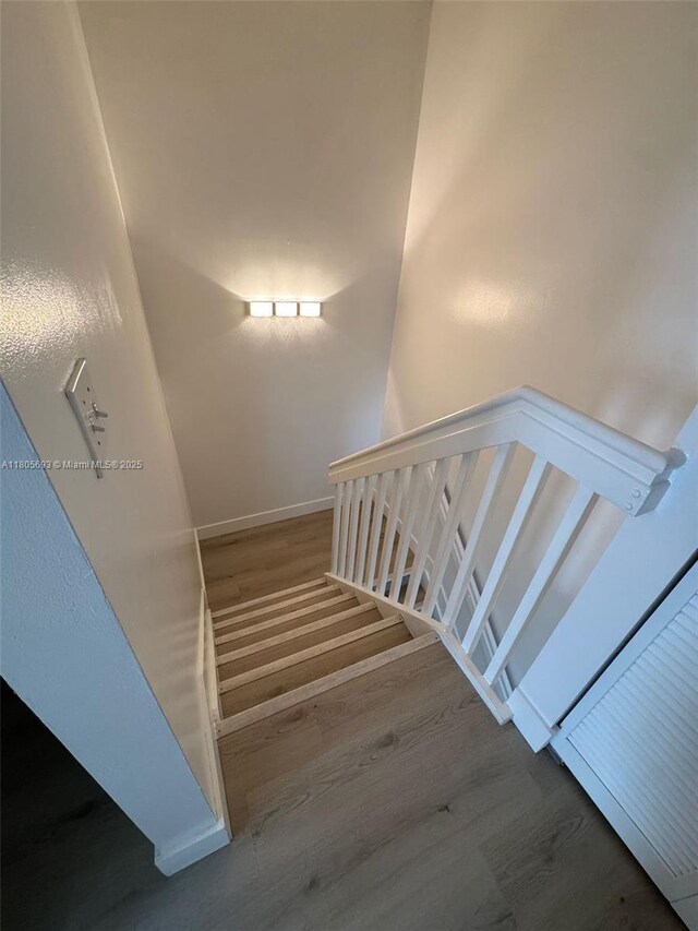 12605 SW 54th Ct Unit 12605, Miramar, FL 33027 - stairway featuring wood finished floors and baseboards