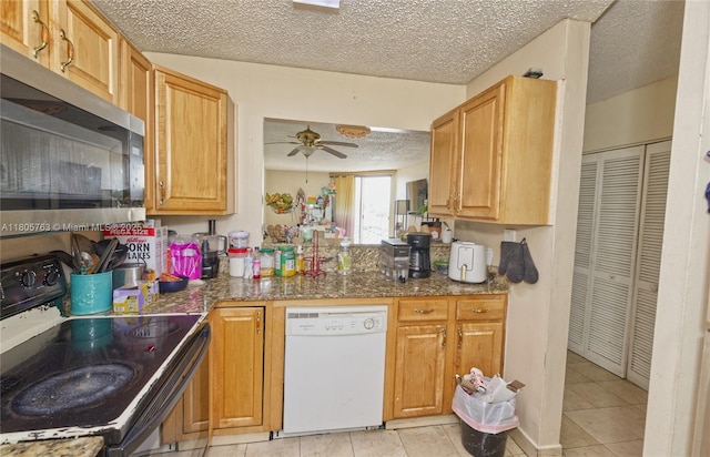 1750 W 46th St Unit 503, Hialeah, FL 33012 - kitchen with black electric range oven, white dishwasher, stainless steel microwave, a textured ceiling, and a ceiling fan