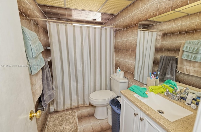 1750 W 46th St Unit 503, Hialeah, FL 33012 - bathroom with toilet, vanity, and tile walls
